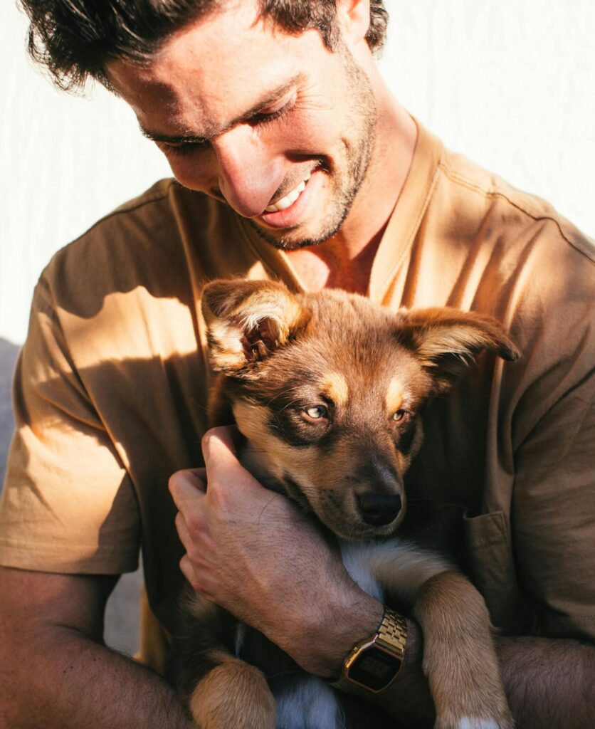 Man holding puppy